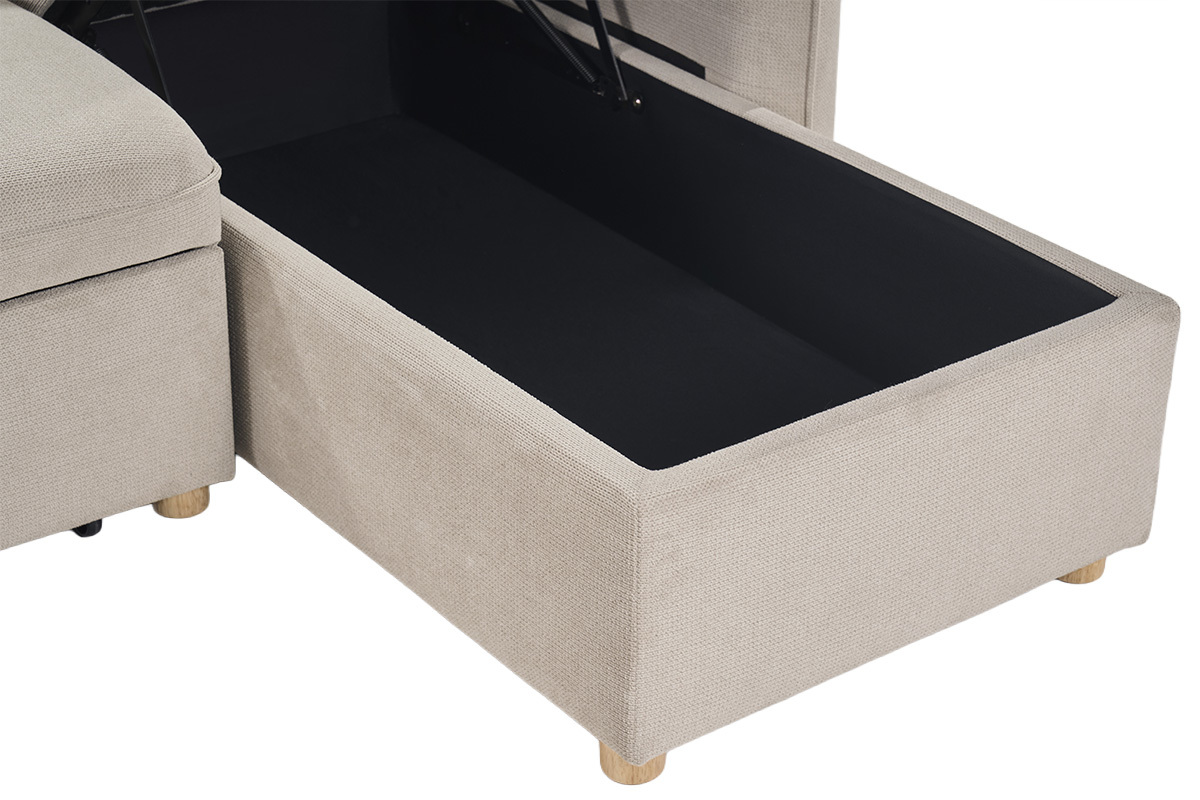 Coffre ouvert d'un canap� d'angle convertible en tissu beige avec pieds en bois clair.